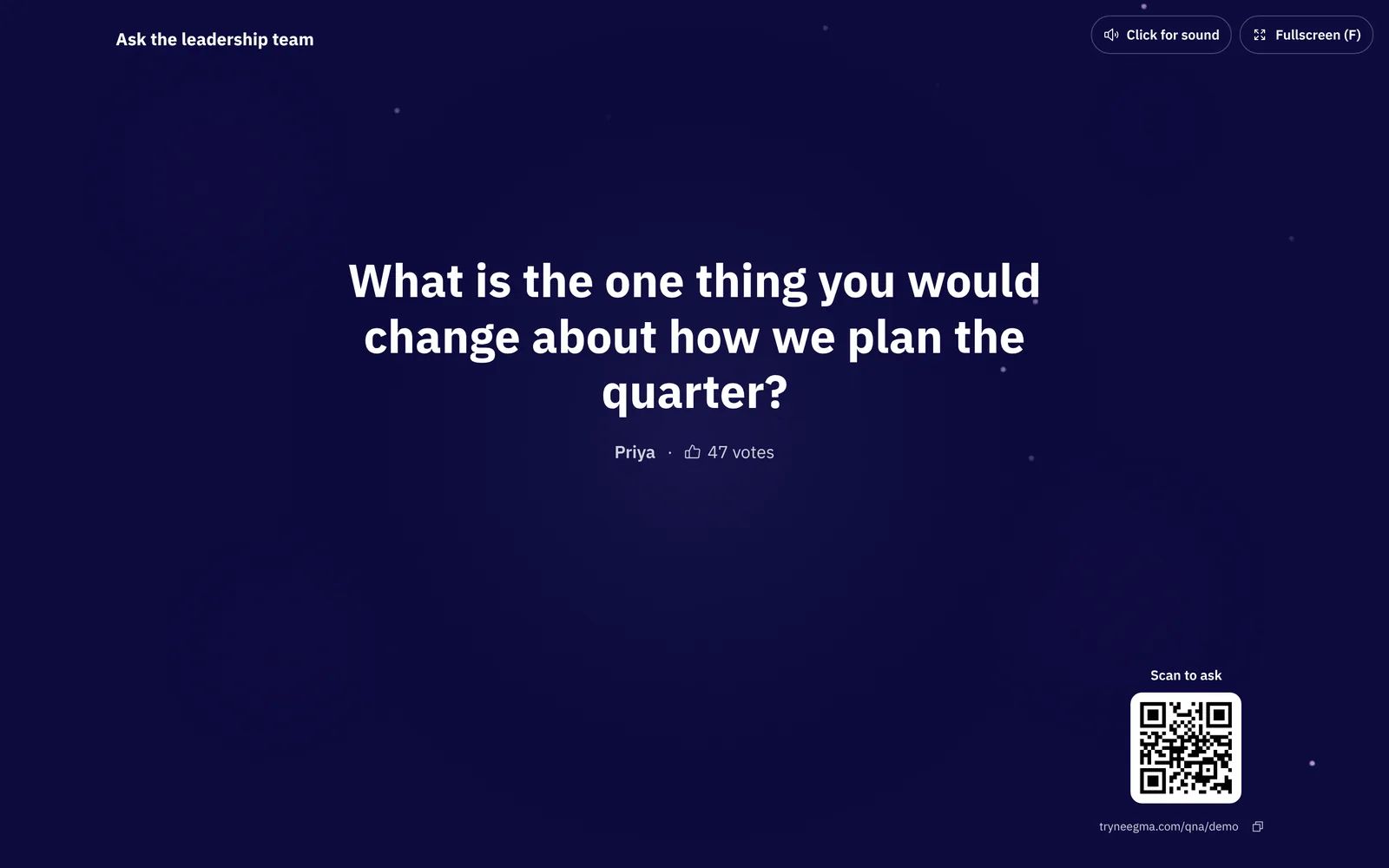 The Q&A big screen showing the question being answered with its asker and 47 votes, and a Scan to ask QR code in the corner